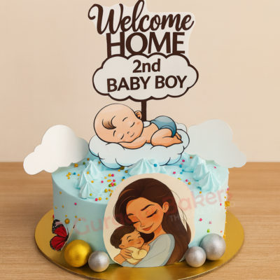 A pastel blue cake decorated for a baby shower with a sleeping baby design and a mother holding her child