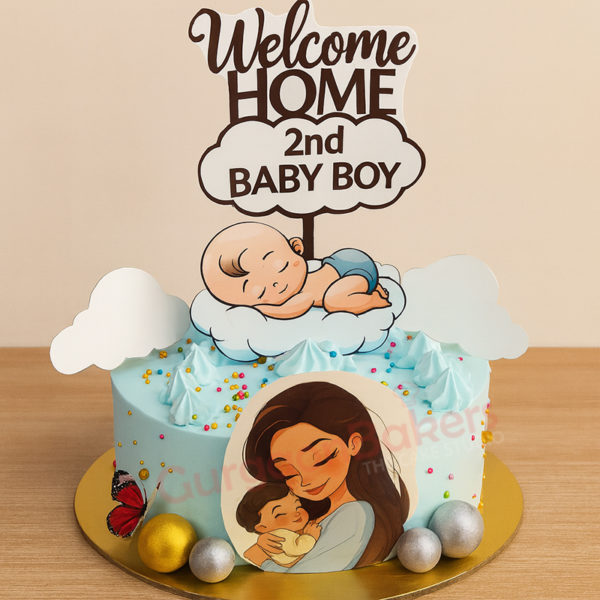 A pastel blue cake decorated for a baby shower with a sleeping baby design and a mother holding her child