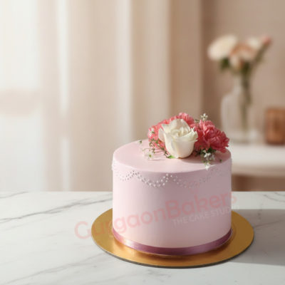 Elegant pink anniversary cake with flowers