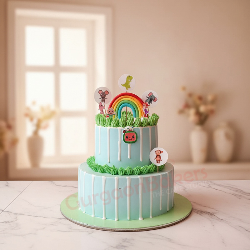 best-cocomelon-cake-in-gurgaon Two-tier Cocomelon cake with rainbow and characters