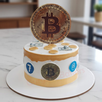 Bitcoin Bonanza Cake with edible gold coins and Bitcoin topper
