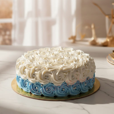 A beautifully designed cake with white and blue rose icing