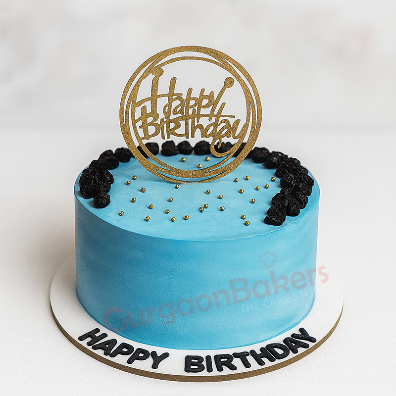 bright-blue-birthday-bliss-cake A beautifully decorated bright blue birthday cake with 'Happy Birthday' topper