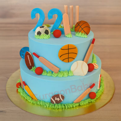A beautifully designed two-tier cricket cake with fondant sports elements