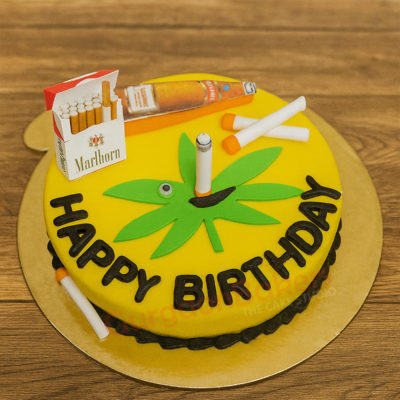 Custom cake for a friend's birthday featuring playful elements like cigarettes and beer