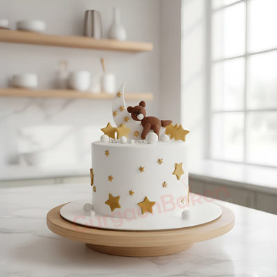 A delightful teddy bear cake decorated with stars and a moon