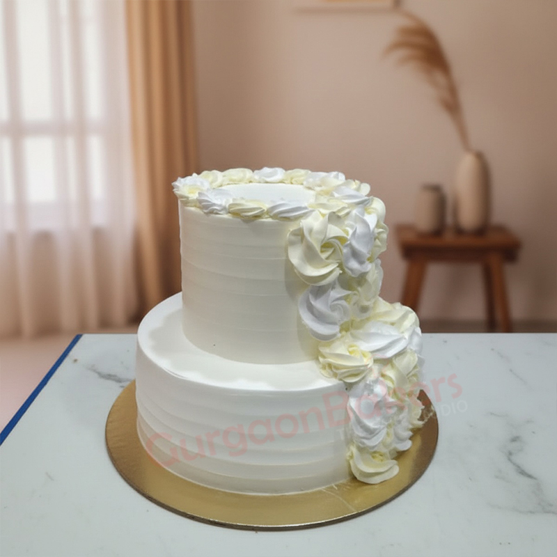 elegant-simple-wedding-cake-gurgaon Elegant two-tier simple wedding cake with white and yellow swirl decorations