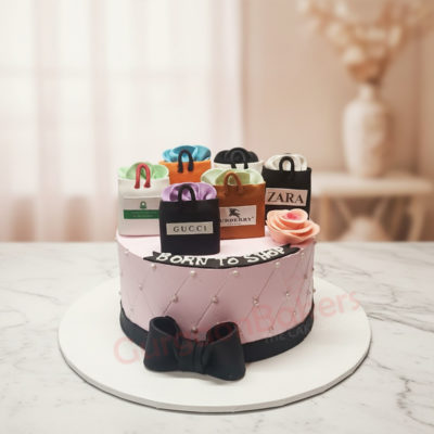 Delicious fashion cake featuring designer handbag decorations