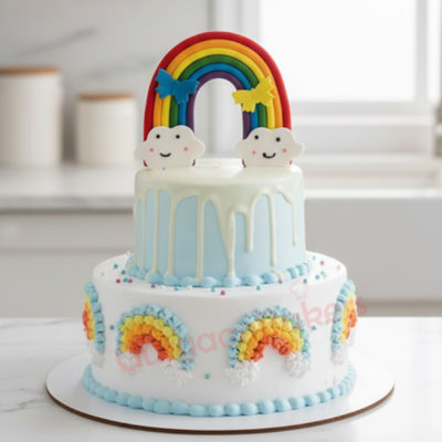 A beautiful two-tiered rainbow cake with clouds and butterflies