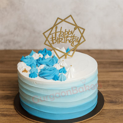Ocean Wave Birthday Cake with blue frosting and golden cake topper