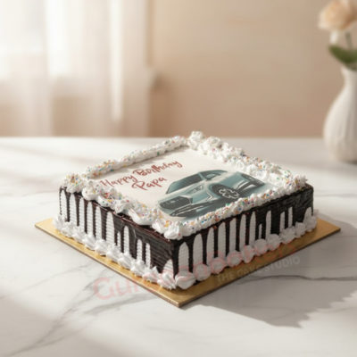 Delicious photo cake with a car image and birthday message