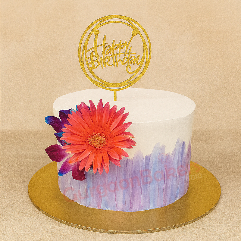 Vibrant Floral Birthday Cake A vibrant floral birthday cake with a golden 'Happy Birthday' topper and colorful flowers