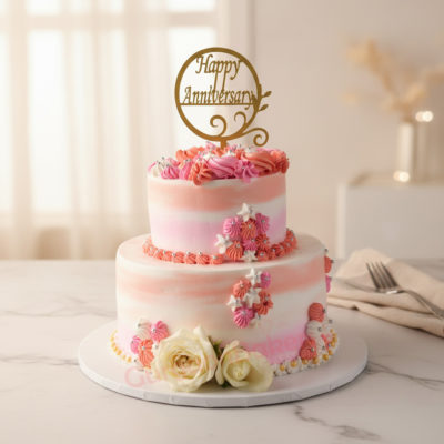 Delightful 2 tier anniversary cake with flowers and a 'Happy Anniversary' topper