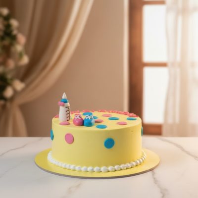 A cheerful yellow baby shower cake with playful decorations.