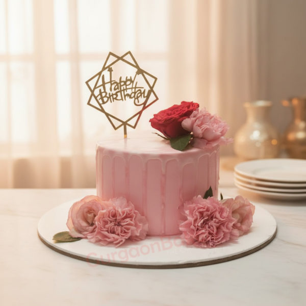 Elegant Pink Birthday Cake adorned with fresh flowers