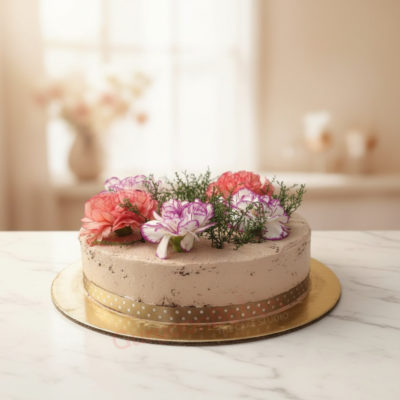 A beautifully decorated birthday cake with flowers