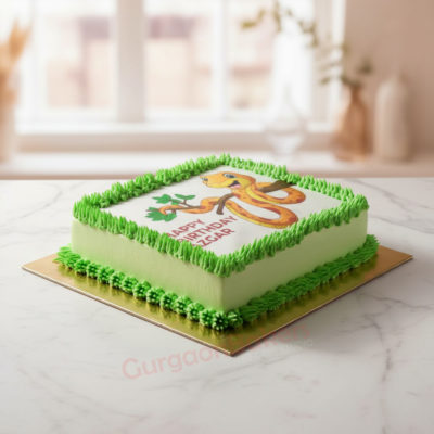 Colorful photo cake with jungle theme and green decorations