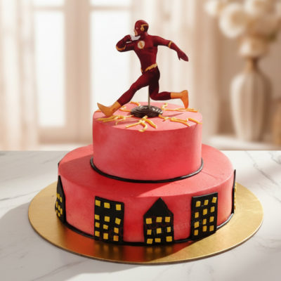 Flash superhero cake with red frosting and city decorations