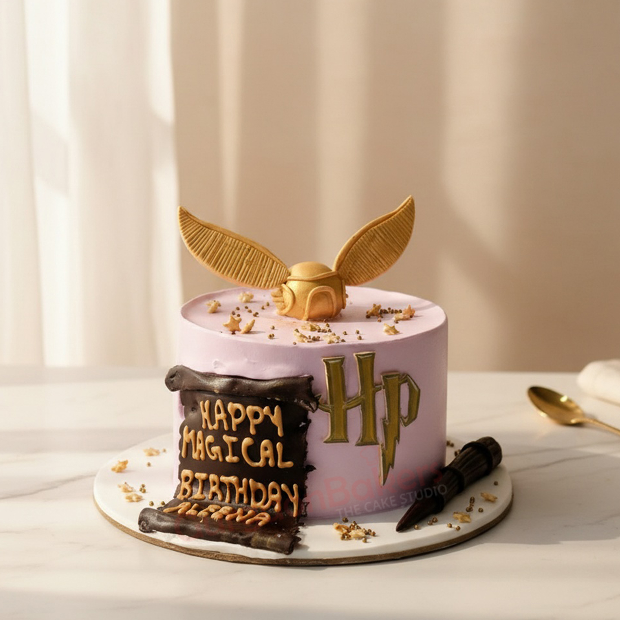magical-harry-potter-cake Harry Potter themed cake featuring a golden snitch and birthday wishes