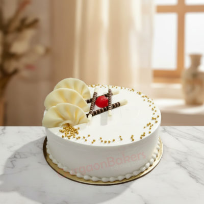 Tropical Delight Cake with fresh fruit and chocolate decor