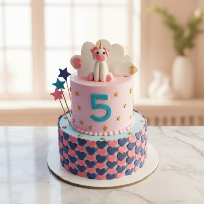 Beautiful unicorn tier cake adorned with pastel colors and a unicorn figurine
