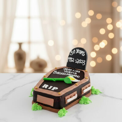 Bachelor farewell cake designed like a tombstone with RIP and personal messages