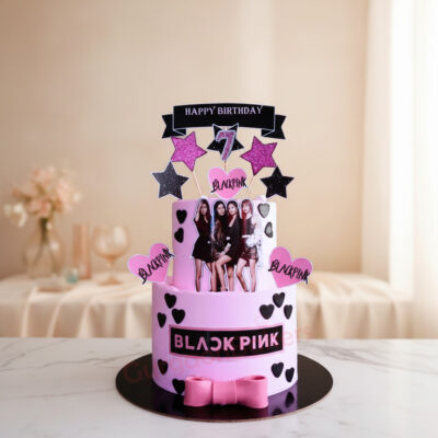 A beautifully crafted Black Pink birthday cake with pink and black decorations and images of the band.