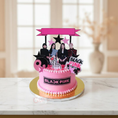 Custom Black Pink cake with decorations and vibrant colors