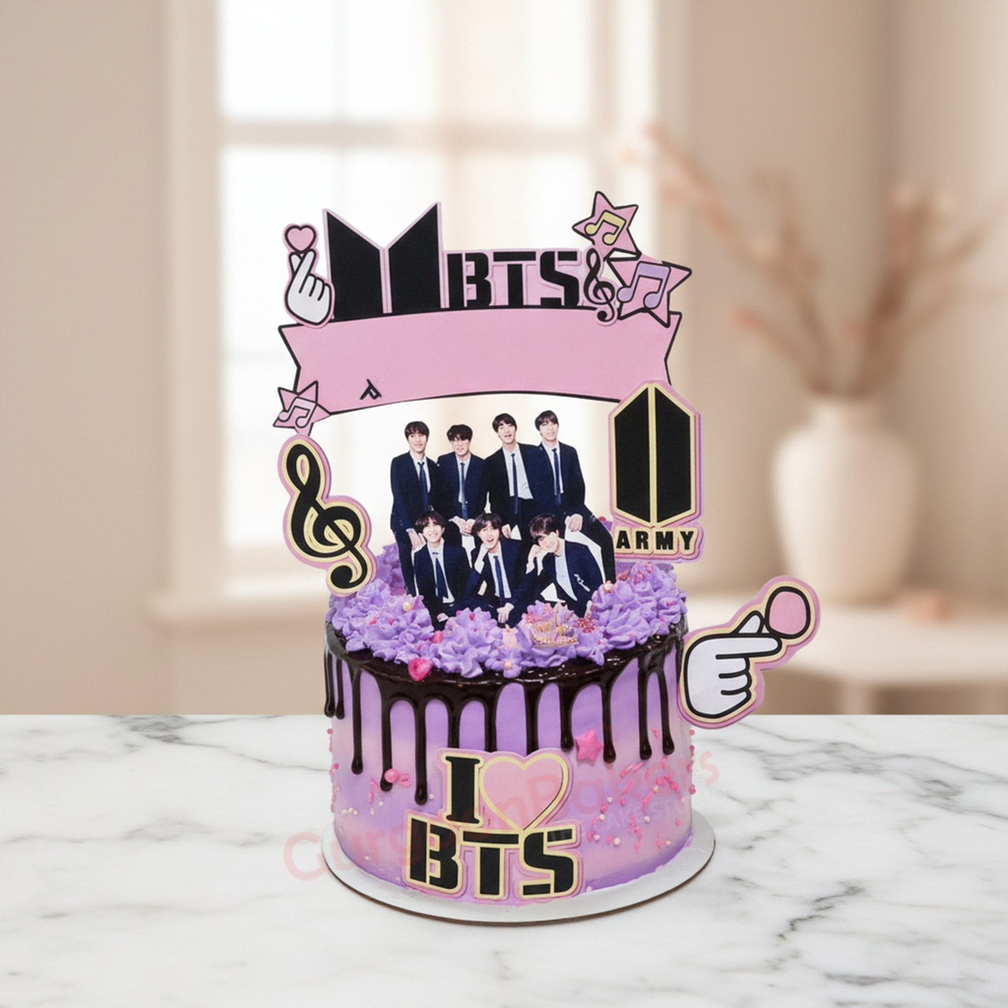 BTS Army Delight Cake BTS Army Delight Cake with violet frosting and fun decorations