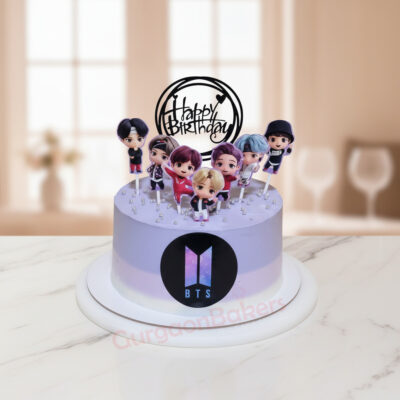 BTS themed birthday cake with figurines of the members and a birthday topper