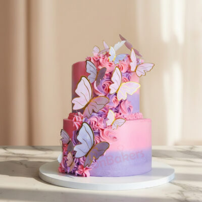 Beautifully designed butterfly cake with pink frosting and edible butterflies.