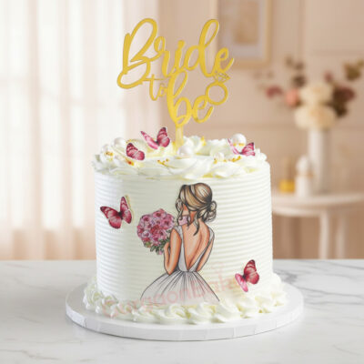 Elegant Bride to Be cake adorned with butterflies and floral decorations