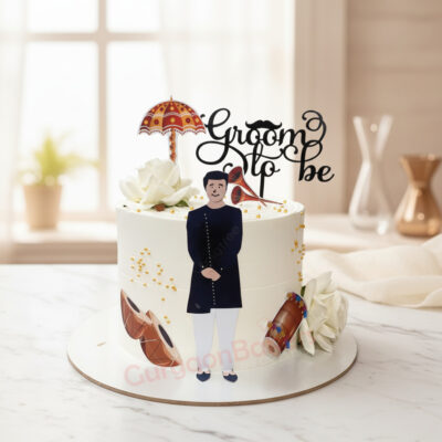 Groom to be cake decorated with flowers and a figurine