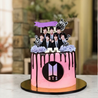 Delicious pink BTS themed cake with band member decorations