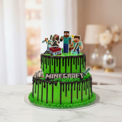 Minecraft themed cake with green icing and gaming figurines