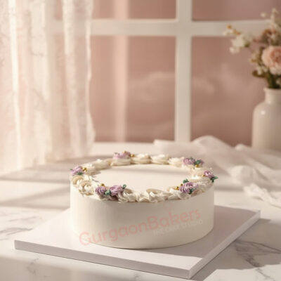 A beautifully decorated healthy cake with floral frosting on a white table