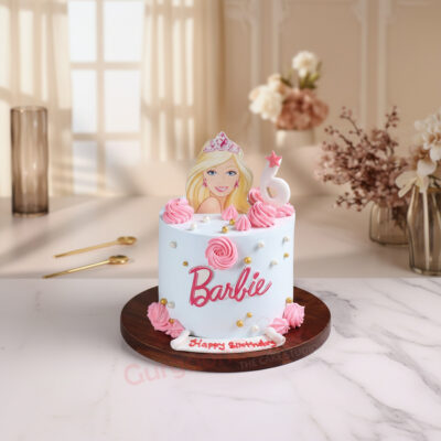 Barbie birthday cake with pink frosting and decorations