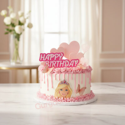 A beautiful Barbie-themed birthday cake with pink frosting and decorations.