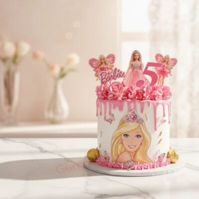 Barbie themed birthday cake with pink frosting and doll decorations