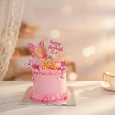 A delightful Barbie-themed birthday cake decorated with pink frosting and Barbie figures.