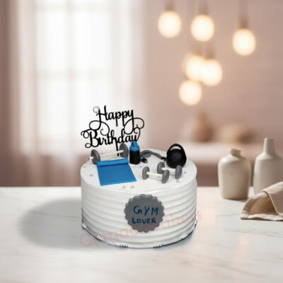 Gym themed cake with dumbbells and a yoga mat