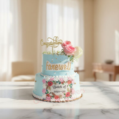 A beautiful blue farewell cake with flowers and a congratulations topper