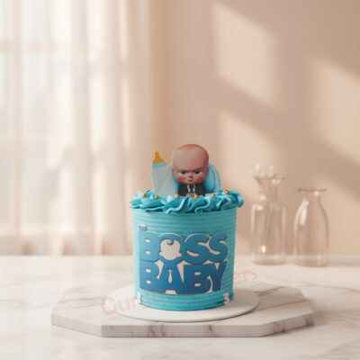 A playful Boss Baby cake adorned with blue frosting and a cute topper.
