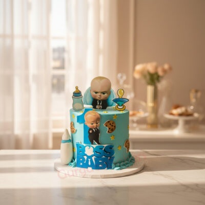 Delicious Boss Baby theme cake with blue frosting and character decorations