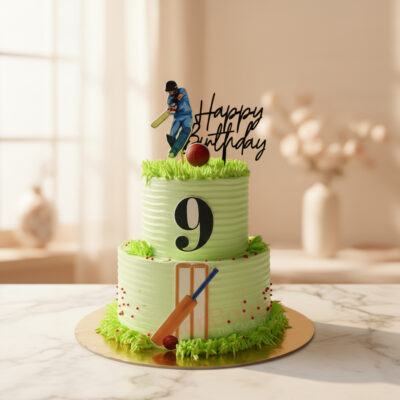 Two-tiered cricket birthday cake with green frosting and cricket decor
