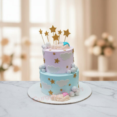 Two-tiered baby shower cake with clouds and stars