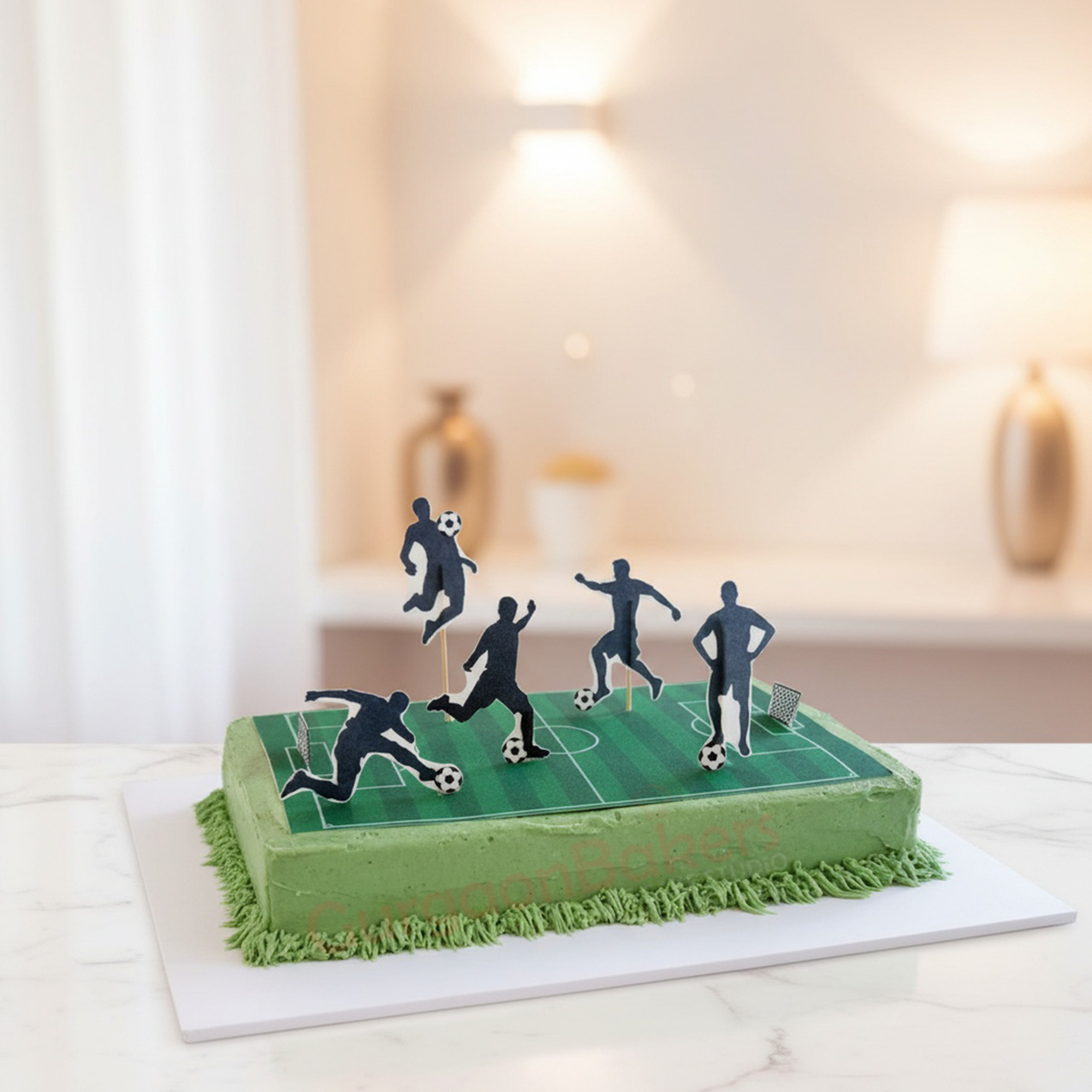 Goal-Getter Football Cake A vibrant green football themed cake with player figures