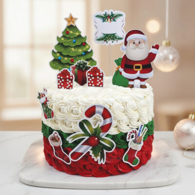 Festive Christmas cake decorated with Santa, gifts, and a Christmas tree.