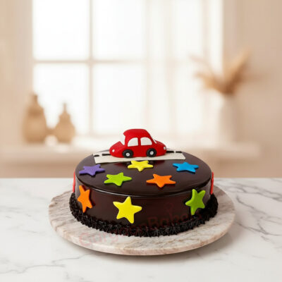 Joyride Car Cake decorated with a fondant car and colorful stars