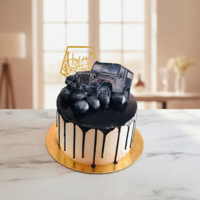 Luxury Car Cake with a black vehicle design and chocolate drip